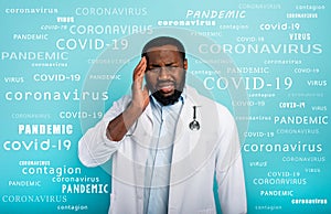 Doctor is exhausted due to overwork by coronavirus covid-19. Cyan background photo