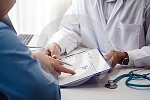 Doctor explain health check document of male patient in medical clinic or hospital health. health and doctor concept photo