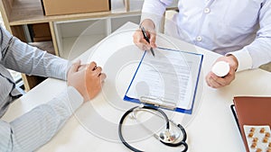 Doctor explaining and giving a consultation to a patient medical informations and diagnosis about the treatment for condition in