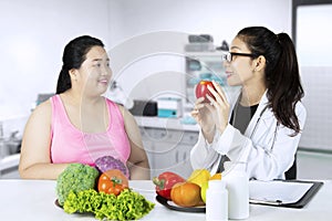Doctor explaining healthy foods for her patient