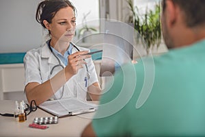 Doctor checking the ankle X-ray