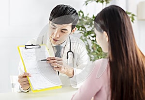 Doctor explaining medical reports to his patient