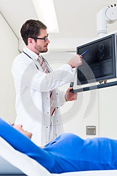 Doctor explaining patient MRI scan on screen