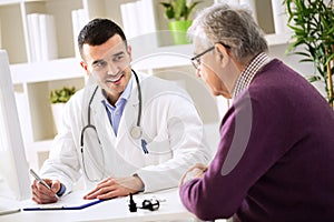Doctor explaining prescription to senior patient