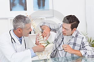 Doctor explaining the spine to a patient