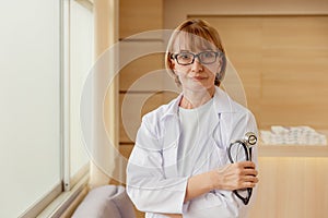 Doctor female standing confident smiling in hospital for healthcare service