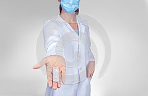 Doctor female  wear face mask hand show rapid laboratory COVID-19 test for diagnosis new Corona virus infection or Antigen test