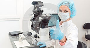 Doctor in fertility lab having just fertilized a human egg with