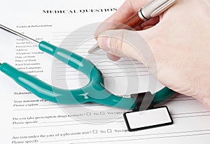 Doctor filling in medical questionnaire