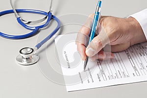 Doctor Filling Out Medical Form