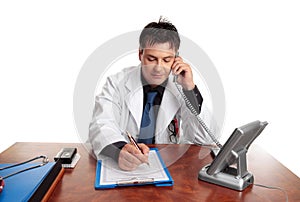 Doctor filling out patient record
