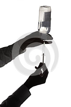 Doctor filling syringe