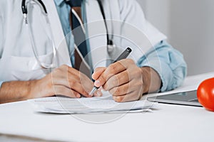 Doctor fills in data taking into account patient`s analyzes. Filling out patient medical history, personal data. Diagnosed