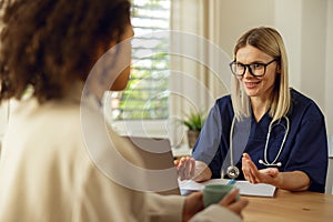 Doctor fills out the medical report form on medical care of patients during appointment