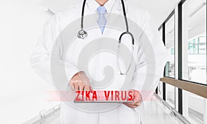 Doctor finding Internet pages about ZIKA virus on digital tablet