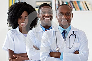 Doctor and general practitioner and nurse as african american medical team