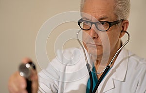 Doctor getting ready to check hear beat with stethoscope