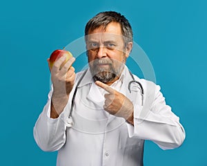 Doctor giving apple for healthy eating