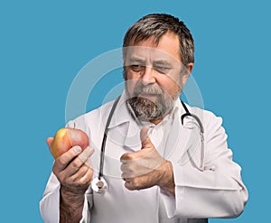 Doctor giving apple for healthy eating