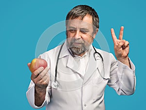 Doctor giving apple for healthy eating