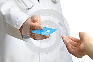 Doctor giving business card to patient isolated on white. Medical service.