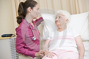 Doctor giving checkup to woman photo