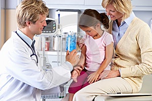 Doctor Giving Child Injection In Doctor's Office