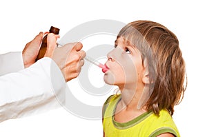 Doctor giving child medication