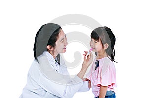 Doctor giving child medication by syringe. Isolated on white background.