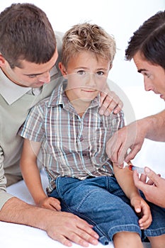Doctor giving an injection to a child