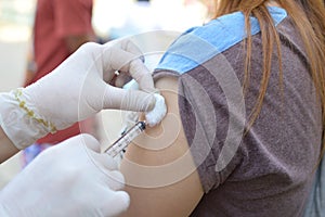 Doctor giving an injection to a patient