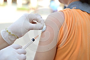 Doctor giving an injection to a patient