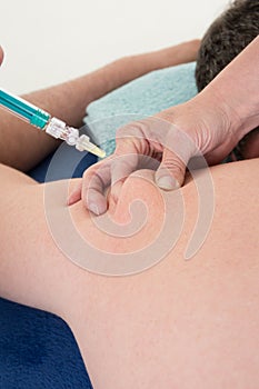 Doctor Giving Male Patient Injection Vaccinating