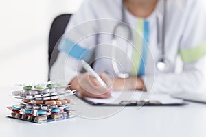 Doctor giving many medical tablets