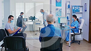 Doctor giving nurse patient radiography