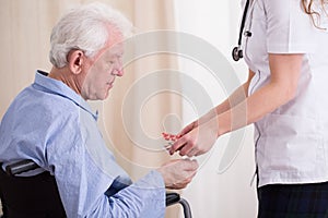 Doctor giving patient medicament