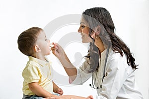 Doctor giving remedy to kid