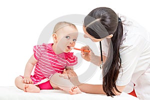 Doctor giving remedy to kid girl