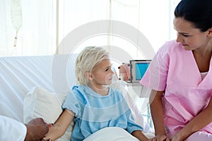 Doctor giving vaccine to a little female patient