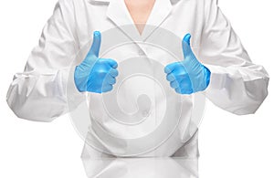 Doctor in gown and blue gloves showing thumbs up signs