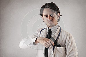 Doctor with a gun coming out of his pocket