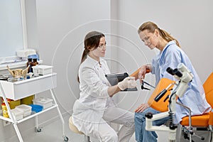 Doctor gynecologist showing result of medical exam to patient