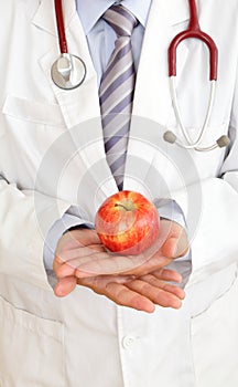 Doctor hand with a apple