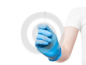 Doctor hand in blue sterile glove hold to give cotton swab for sampling smear analysis.