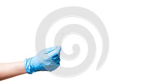 Doctor hand in a blue sterile glove holds a cotton swab.