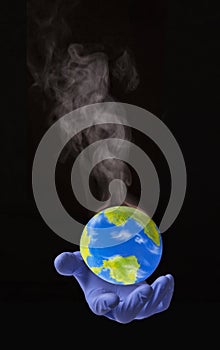 Doctor hand hold a warming smoke planet earth globe