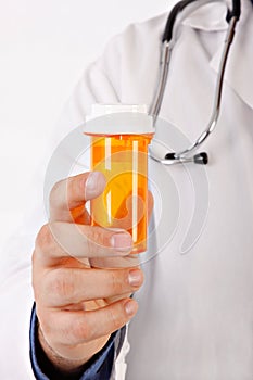 Doctor Hand Holding Medicine Bottle