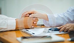 doctor hand holding the patient's hand. To encourage and comfort the patient so that the patient is not sad and worried