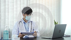 Doctor hand holding pen writing patient history list on clipboard about medication and treatment