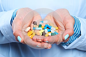 Doctor hand holding pills close up view  - Image